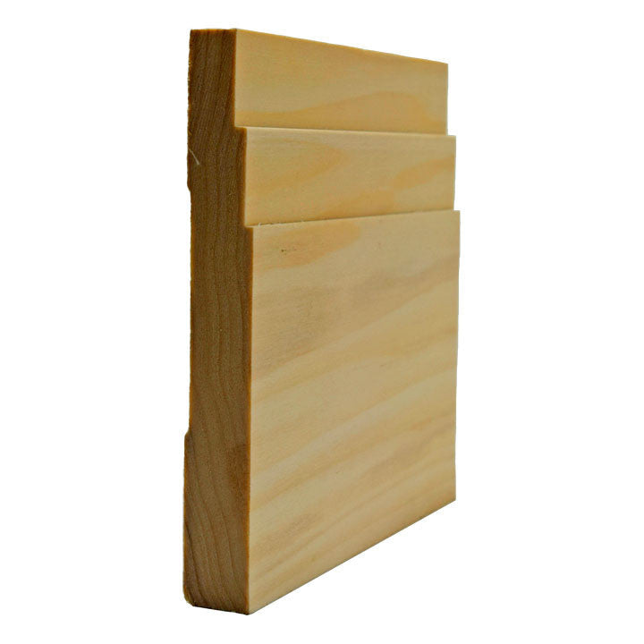 EWBB29 Stepped 5-1/4 inch Tall Baseboard Molding on white background. Unfinished square edge baseboard moulding in a natural wood color, shown with a cross-sectional view.