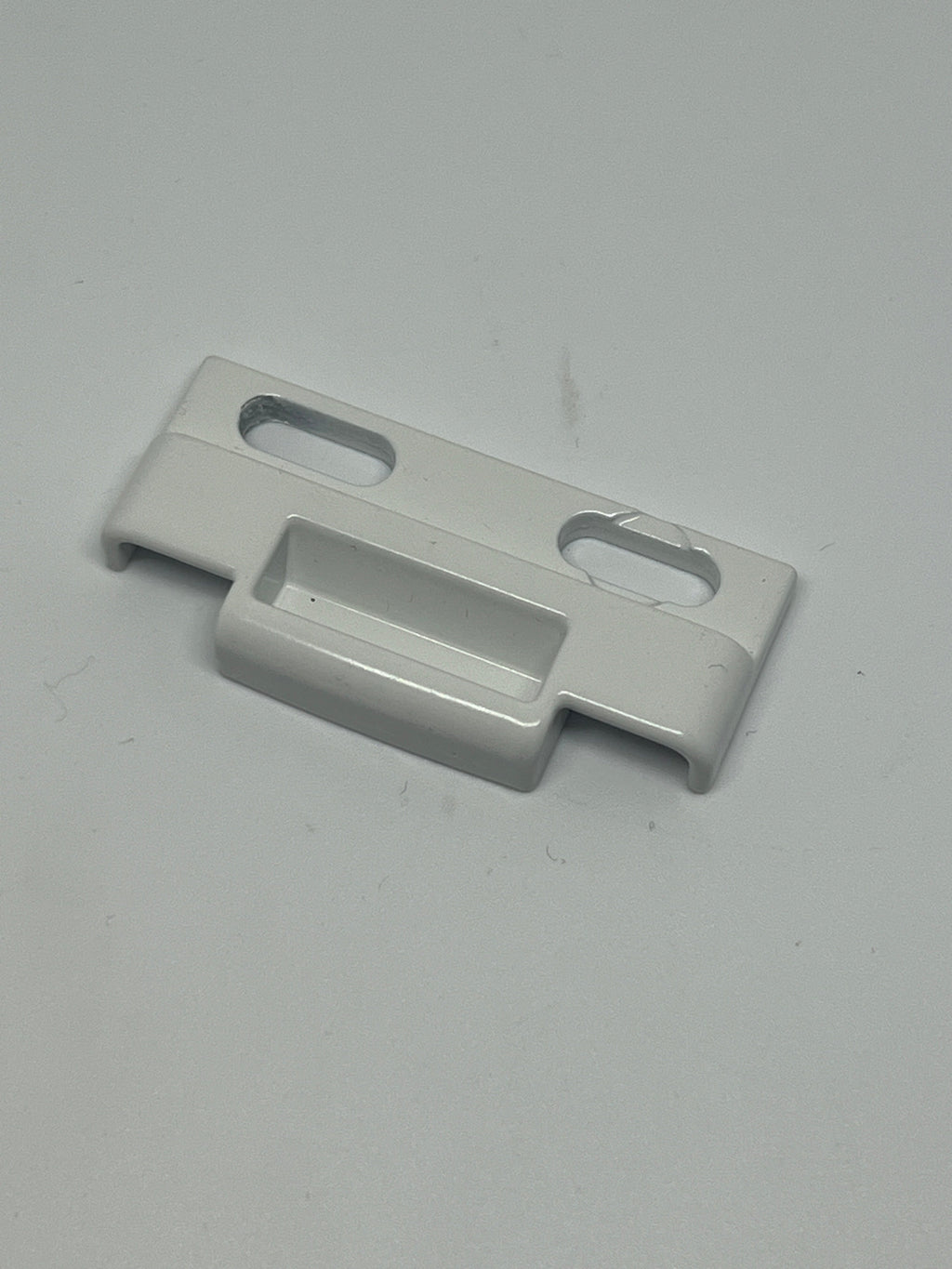 C1010K 25137 Positive Action Lock Keeper Face Mount PAL. White metal part on a white background.