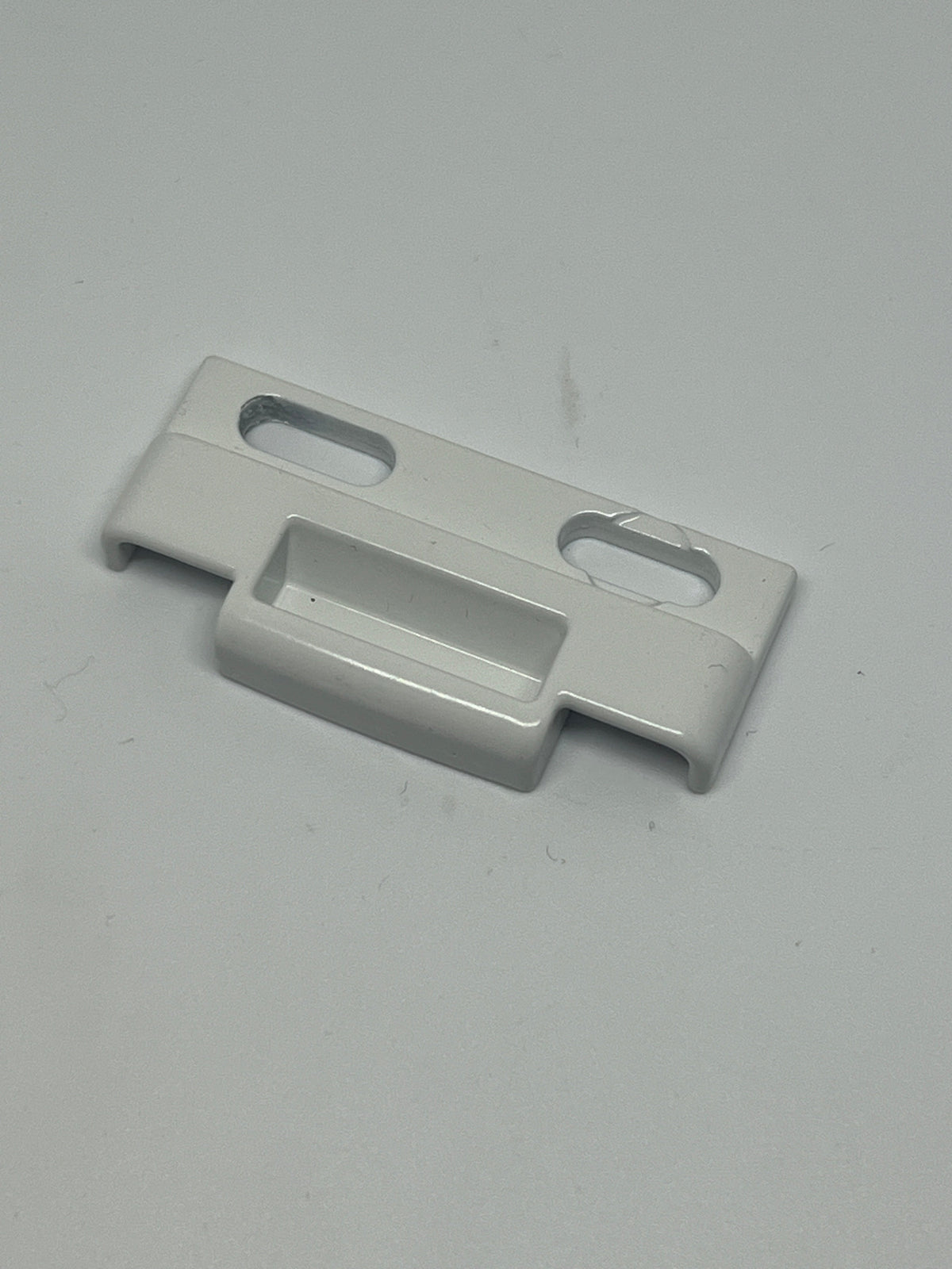 C1010K 25137 Positive Action Lock Keeper Face Mount PAL. White metal part on a white background.