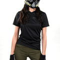 Woman wearing a SUPER73 x 100% Ridecamp Women's Jersey against a white background