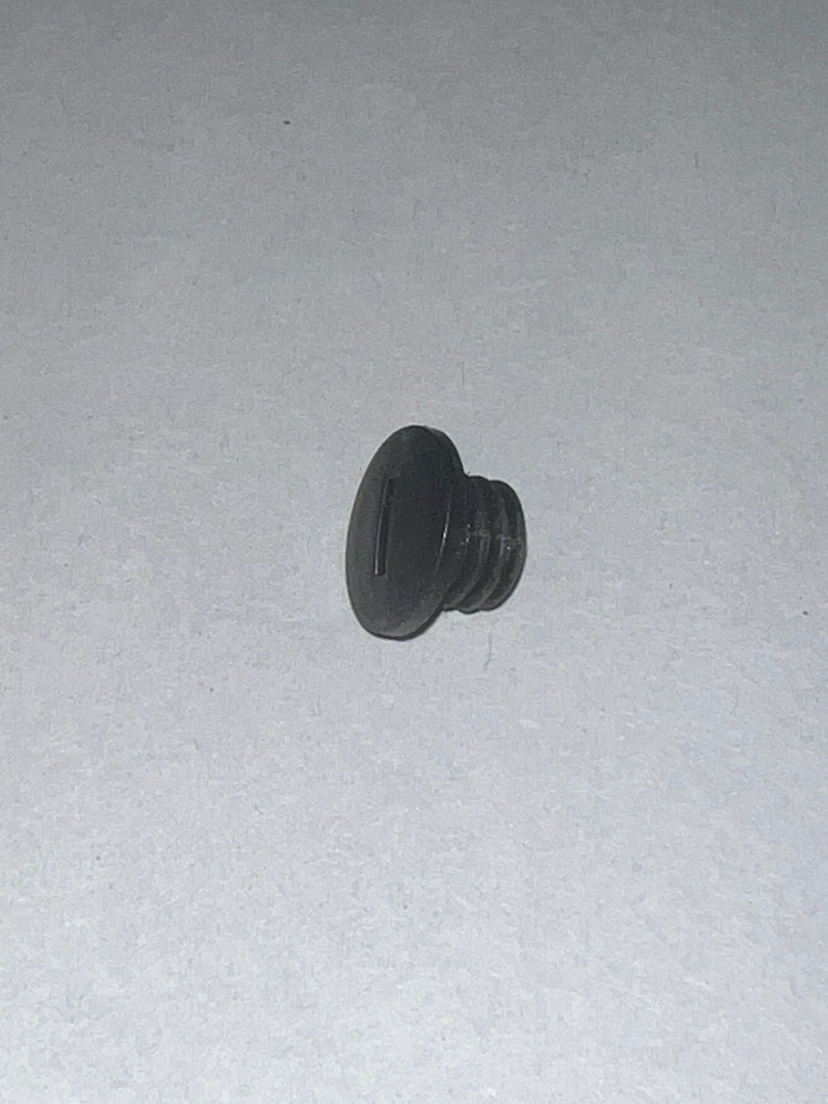 S4301 Hinge Cap for HG100 and HG200 Amesbury Truth Dual Adjustable Door Hinge. A black screw on white surface