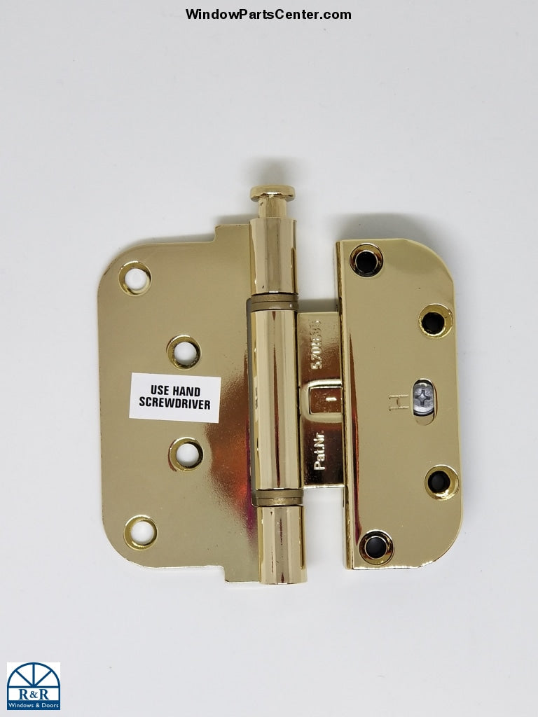 S4010 door hinge in bright brass on a white background. White sticker on hinge says “use hand screw driver” this would be to adjust the hinge. HTL Ultimate 2-D Hinge - Hoppe Guide Hinge AdjustableKnown Part # 850-8762435,  Pat.Nr. 5.701.636. Color Bright Brass / Gold